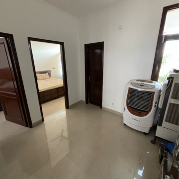 Living Room in 2 BHK Apartment at Dhakoli Village – for Sale