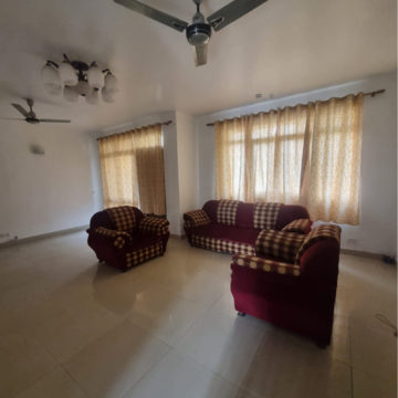 Living Room in 1 BHK Apartment at Omaxe NRI City Apartments, Omega Ii Greater Noida – for Rent