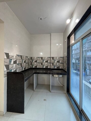 Kitchen in 2 BHK Apartment at Shivkala CHS, Vasai East – for Sale