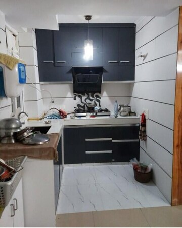 Kitchen in 2 BHK Apartment at Amrapali Princely Estate, Sector 76 – for Rent