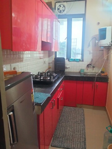 Kitchen in 2.5 BHK Apartment at Aims Golf City, Sector 75 – for Rent