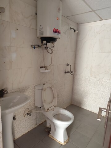 Bathroom in 2 BHK Apartment at Aims Golf City, Sector 75 – for Rent