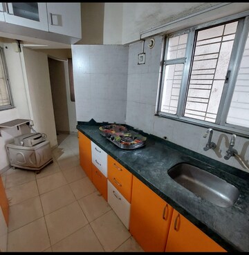 Kitchen in 1.5 BHK Apartment at Karan Rhea, Wadegaon – for Rent
