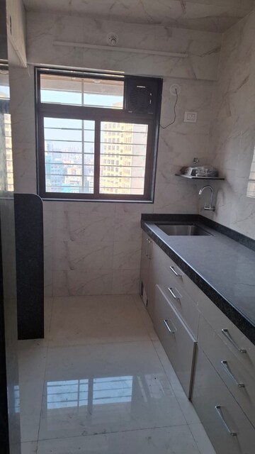 Kitchen in 1 BHK Apartment at Abhirekha Apartments, Kandivali West – for Rent