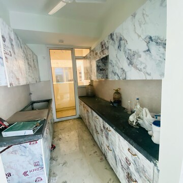 Kitchen in 3 BHK Apartment at Mahagun Mirabella, Sector 79 – for Rent