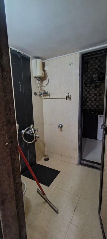 Bathroom in 3 BHK Apartment at Unique Heights CHS, Mira Road – for Rent