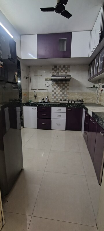 Kitchen in 3 BHK Apartment at Unique Heights CHS, Mira Road – for Rent