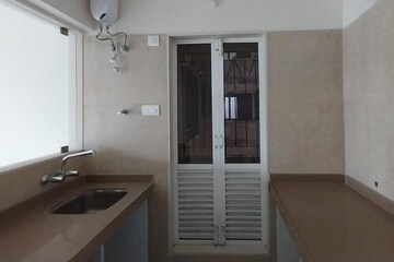 Kitchen in 1.5 BHK Apartment at Dosti West County, Balkum Pada – for Rent