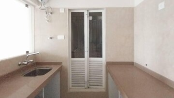Kitchen in 1.5 BHK Apartment at Dosti West County, Balkum Pada – for Sale