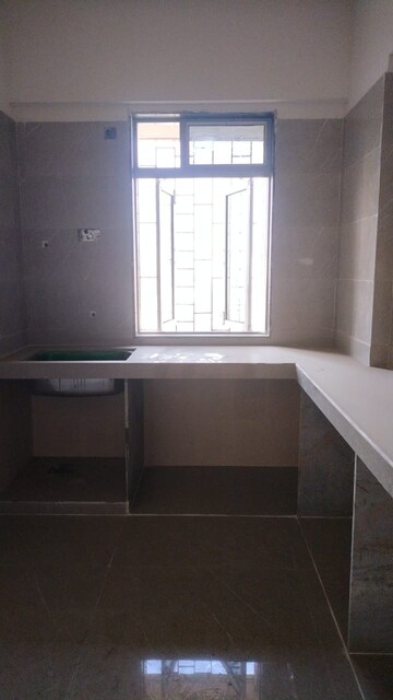 Kitchen in 1 BHK Apartment at Cosmos Classique, Ghodbunder Road – for Sale