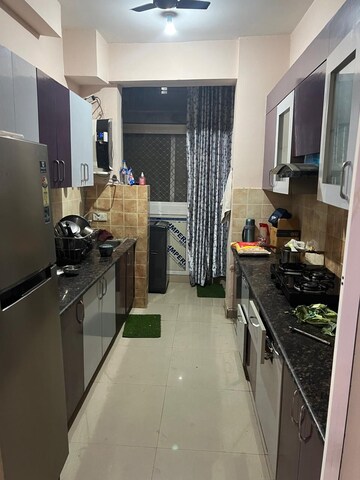 Kitchen in 2 BHK Apartment at Aims Golf City, Sector 75 – for Rent