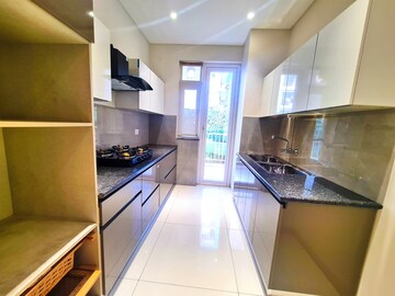 Kitchen in 3 BHK Apartment at Motia Blue Ridge, Dhakoli Village – for Sale