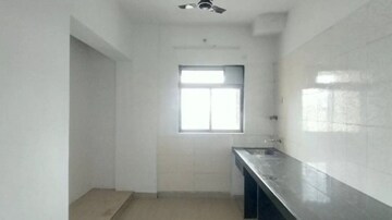 Kitchen in 2 BHK Apartment at Vardhman Gardens, Balkum Pada – for Sale