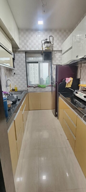 Kitchen in 2 BHK Apartment at Swastik Residency, Dapode – for Rent