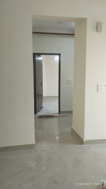Living Room in 2 BHK Apartment at Aims Golf City, Sector 75 – for Rent