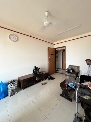 Living Room in 1 BHK Apartment at Godrej Golf Meadows, Poyanje – for Rent