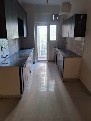 Kitchen in 2.5 BHK Apartment at Aims Golf City, Sector 75 – for Rent