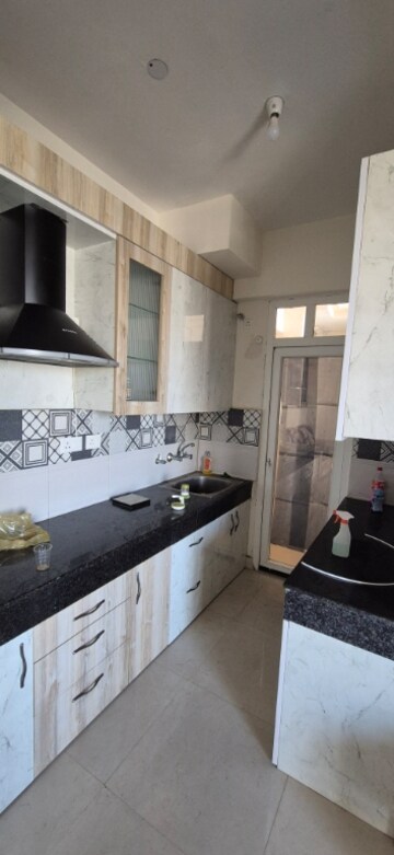 Kitchen in 2 BHK Apartment at Signature The Serenas, Sohna Sector 36 – for Rent