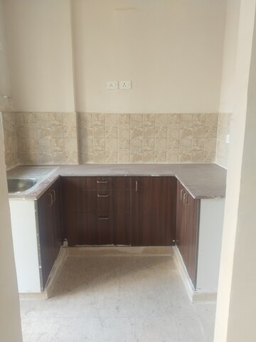 Kitchen in 2 BHK Apartment at Amrapali Golf Homes, Sector 4, Greater Noida – for Sale