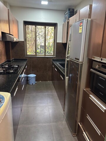 Kitchen in 3 BHK Apartment at Rizvi Danda, Carter Road – for Rent