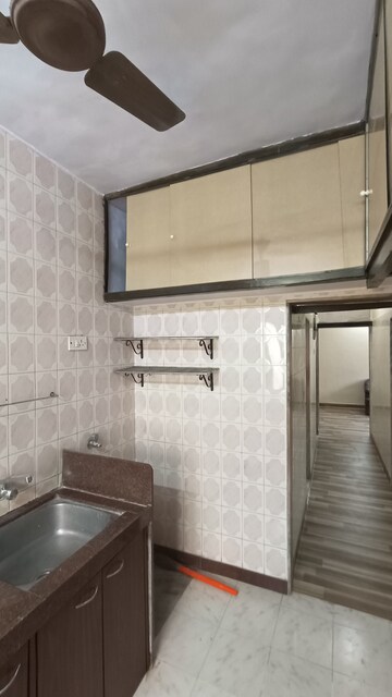 Kitchen in 1 BHK Apartment at Gokuldham Complex, Goregaon East – for Rent