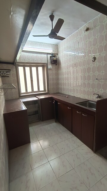 Kitchen in 1 BHK Apartment at Gokuldham Complex, Goregaon East – for Rent