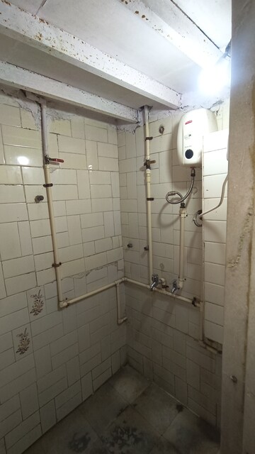 Bathroom in 1 BHK Apartment at Dak Sangathan CHS, Malad East – for Rent