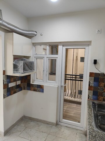 Kitchen in 2 BHK Apartment at Gaur City 2 - 14th Avenue, Sector 16c Greater Noida – for Rent
