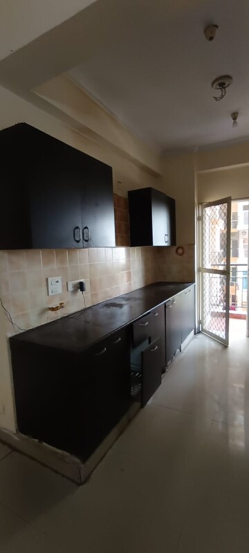 Kitchen in 3 BHK Apartment at Amrapali Silicon City, Sector 76 – for Rent