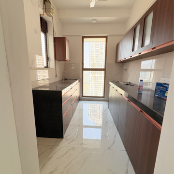 Kitchen in 2 BHK Apartment at Raymond Ten X Habitat, Swastik Garden – for Rent