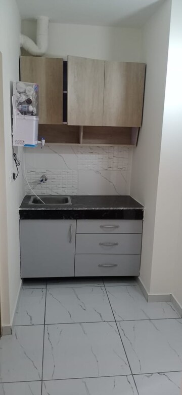Kitchen in 1 RK Apartment at Dhoot Time Residency, Sector 63 – for Rent