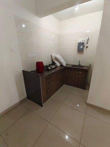 Kitchen in Studio Apartment at Gera World of Joy, Kharadi – for Rent