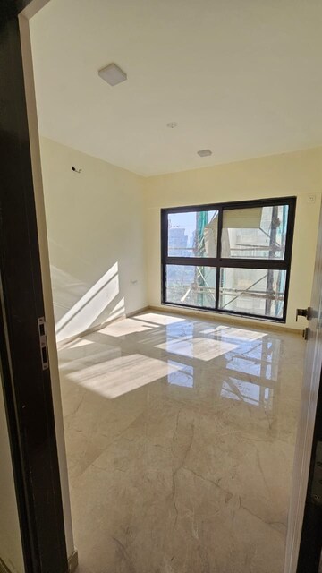 Room in 2 BHK Apartment at Cosmopolis Tower, Andheri West – for Sale