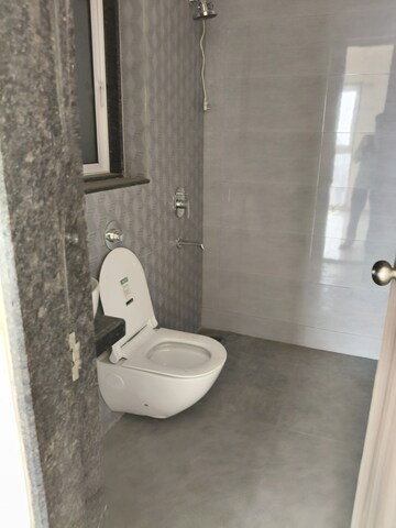 Bathroom in 2.5 BHK Apartment at Rodas Enclave Evergreen, Patlipada – for Rent