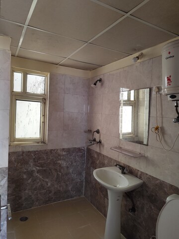 Bathroom in 2 BHK Apartment at Aims Golf City, Sector 75 – for Sale