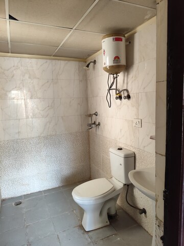 Bathroom in 2 BHK Apartment at Aims Golf City, Sector 75 – for Sale