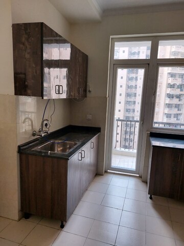 Kitchen in 4 BHK Apartment at Amrapali Sapphire, Sector 45 – for Sale