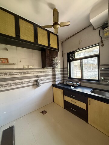 Kitchen in 1 RK Apartment at Shree Suryodaya CHS, Dahisar East – for Rent