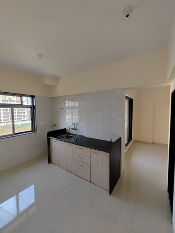 Kitchen in 2 BHK Apartment at Pranjee Garden City, Katrap – for Sale