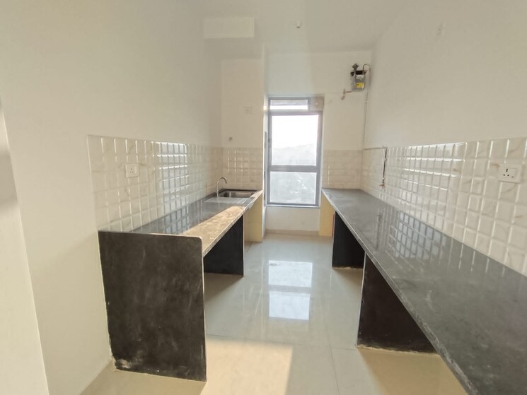 Kitchen, kalpataru-immensa 2 Bedroom 808 Sq.Ft. Apartment In Kolshet Road Thane 8202902