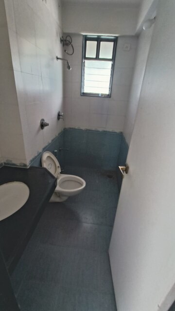 Bathroom in 3 BHK Apartment at Bhartiya Rakshak Adhikari CHS, Andheri West – for Rent