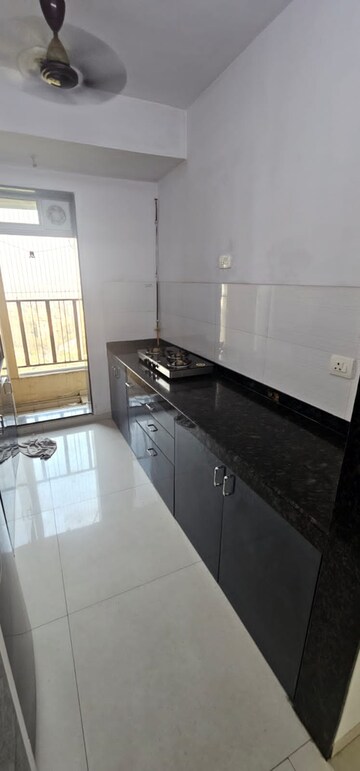 Kitchen in 2 BHK Apartment at Rustomjee Urbania Aurelia, Majiwada – for Rent