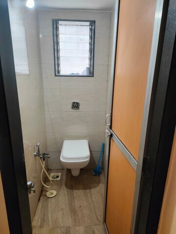 Bathroom in 1 BHK Apartment at Ramdevi CHS, Khar West – for Rent