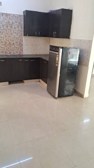 Kitchen in 2 BHK Apartment at Aims Golf City, Sector 75 – for Rent
