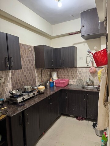 Kitchen in 2 BHK Apartment at Supertech Livingston, Sain Vihar – for Rent