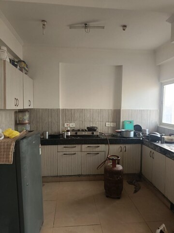 Kitchen in 2 BHK Apartment at Amrapali Silicon City, Sector 76 – for Rent