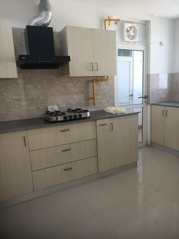 Kitchen in 2 BHK Apartment at Jaypee Greens Kalypso Court, Sector 128 – for Rent