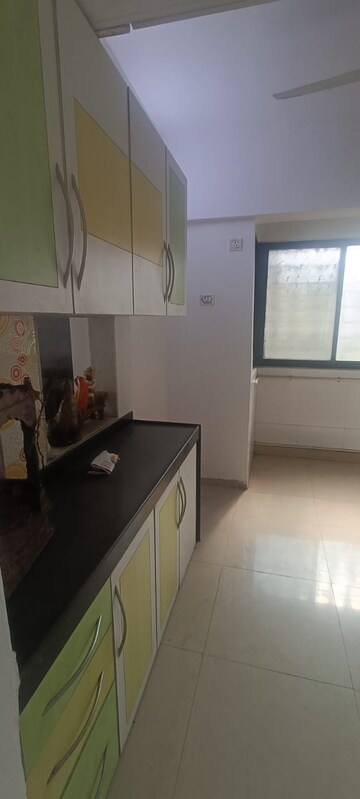 Kitchen in 3 BHK Apartment at Soham Garden, Manpada – for Rent