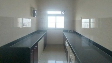 Kitchen in 2 BHK Apartment at Rustomjee Urbania, Majiwada – for Rent