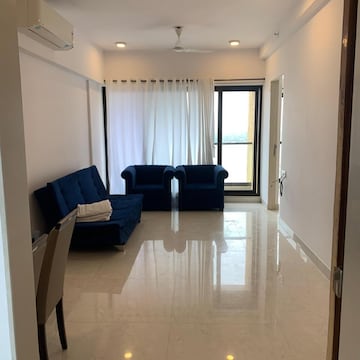 Living Room in 2 BHK Apartment at Kanakia Hollywood, Yari Road – for Rent